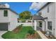 View of backyard with new grass, small palm trees, and white privacy fence at 3480 Fairway Ln, Orlando, FL 32804