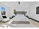 Bright bedroom with tufted headboard, plush rug, and ample natural light from surrounding windows at 3480 Fairway Ln, Orlando, FL 32804