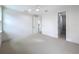 Bright bedroom with carpet flooring, neutral colors, and a view into an adjacent walk-in closet at 3480 Fairway Ln, Orlando, FL 32804