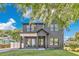 Beautiful two-story home featuring a modern farmhouse design with a well-manicured lawn and tasteful landscaping at 3480 Fairway Ln, Orlando, FL 32804