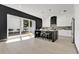 Spacious kitchen with an island, bar stool seating, stainless steel appliances, and access to the backyard at 3480 Fairway Ln, Orlando, FL 32804