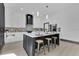 Bright, open kitchen featuring a large center island with seating, modern appliances, and stylish backsplash at 3480 Fairway Ln, Orlando, FL 32804