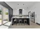 Modern kitchen with stainless steel appliances, an island with seating, and pendant lighting, perfect for cooking at 3480 Fairway Ln, Orlando, FL 32804