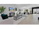 Bright, open-concept living room and dining area with modern decor and ample natural light at 3480 Fairway Ln, Orlando, FL 32804