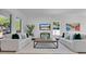 Modern living room with sleek furniture, neutral tones, and a large window, creating a cozy atmosphere at 3480 Fairway Ln, Orlando, FL 32804