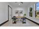 Well-lit home office with a modern desk, large windows, and minimalist decor at 3480 Fairway Ln, Orlando, FL 32804