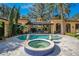 Luxurious backyard pool area featuring a spa, covered outdoor seating and mature landscaping, creating a private retreat at 1400 Alabama Dr, Winter Park, FL 32789