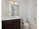 Clean bathroom with dark vanity and shower/tub combo at 16829 Bolsena Dr, Montverde, FL 34756