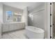 Spa-like bathroom with soaking tub and double vanity at 16829 Bolsena Dr, Montverde, FL 34756