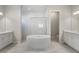 Elegant bathroom with soaking tub and double vanity at 16829 Bolsena Dr, Montverde, FL 34756
