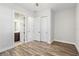 Bedroom with wood-look floors and en-suite bathroom at 16829 Bolsena Dr, Montverde, FL 34756