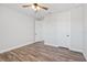 Simple bedroom with wood floors and white walls at 16829 Bolsena Dr, Montverde, FL 34756