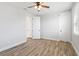 Bright bedroom with wood-look floors and ample closet space at 16829 Bolsena Dr, Montverde, FL 34756