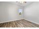 Bright bedroom with wood-look floors and ceiling fan at 16829 Bolsena Dr, Montverde, FL 34756
