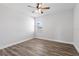 Bedroom with wood floor, ceiling fan and window at 16829 Bolsena Dr, Montverde, FL 34756