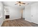 Bedroom with wood floors, ceiling fan, and en-suite bathroom at 16829 Bolsena Dr, Montverde, FL 34756