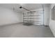 Garage with epoxy flooring and automatic door at 16829 Bolsena Dr, Montverde, FL 34756