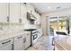 Bright kitchen with stainless steel appliances and access to backyard at 16829 Bolsena Dr, Montverde, FL 34756