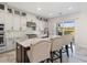 Modern kitchen with island and stainless steel appliances at 16829 Bolsena Dr, Montverde, FL 34756