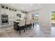 Modern kitchen with stainless steel appliances and an island with seating at 16829 Bolsena Dr, Montverde, FL 34756