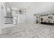 Spacious living room with high ceilings, a grand staircase, and an open floor plan at 16829 Bolsena Dr, Montverde, FL 34756