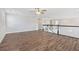 Bright loft area with wood floors and railing at 16829 Bolsena Dr, Montverde, FL 34756