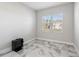 Bright office with large window and marble-look tile floor at 16829 Bolsena Dr, Montverde, FL 34756