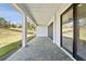 Covered patio with pavers and sliding glass doors at 16829 Bolsena Dr, Montverde, FL 34756