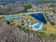 Aerial view of community amenities, including tennis courts, pool, playground, clubhouse and nearby lakes at 17843 Golden Leaf Ln, Orlando, FL 32820