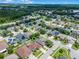 Neighborhood aerial view showcasing the home's location with pond and highway access at 17843 Golden Leaf Ln, Orlando, FL 32820
