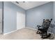 Bedroom featuring carpeted floors, light blue walls, and a double-door closet at 17843 Golden Leaf Ln, Orlando, FL 32820