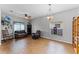 Open-concept living room with tile flooring, ample seating, and a ceiling fan at 17843 Golden Leaf Ln, Orlando, FL 32820