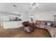 Living room with tile floors, an open layout, and a view into the kitchen area at 17843 Golden Leaf Ln, Orlando, FL 32820