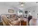 Comfortable living room with tile floors, large windows, and a plush sectional sofa at 17843 Golden Leaf Ln, Orlando, FL 32820