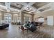 Comfortable lounge area with a leather sofa, coffee table, a pool table, and stylish decor at 17843 Golden Leaf Ln, Orlando, FL 32820