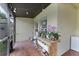 Charming screened patio area with brick flooring, outdoor seating, and gardening space at 17843 Golden Leaf Ln, Orlando, FL 32820
