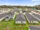 Aerial view of the neighborhood showcasing the homes and green spaces at 8566 Caribbean Pine Way, Lakeland, FL 33809