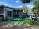 Backyard patio with artificial turf and picnic table at 809 Florida Pkwy, Kissimmee, FL 34743