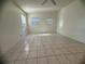 Spacious bedroom with tile floors and ample natural light at 809 Florida Pkwy, Kissimmee, FL 34743