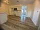 Modern kitchen with white cabinets, microwave, and view to living room at 809 Florida Pkwy, Kissimmee, FL 34743