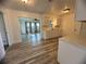 Kitchen with white cabinets and wood-look floors at 809 Florida Pkwy, Kissimmee, FL 34743