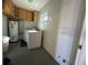 Laundry room with washer, dryer, and ample storage at 809 Florida Pkwy, Kissimmee, FL 34743