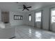 Living room with tile floors and a ceiling fan at 809 Florida Pkwy, Kissimmee, FL 34743