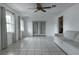 Living room with tile floors and French doors at 809 Florida Pkwy, Kissimmee, FL 34743