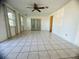 Living room with tile floors and French doors at 809 Florida Pkwy, Kissimmee, FL 34743