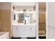 Modern bathroom with double vanity, a shower, and a bathtub at 150 E Robinson St # 1709, Orlando, FL 32801