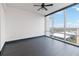 Bright bedroom with dark hardwood floors and large window offering city views at 150 E Robinson St # 1709, Orlando, FL 32801