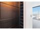 Well-designed closet with built-in shelving and dark wood finish at 150 E Robinson St # 1709, Orlando, FL 32801