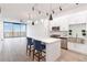 Modern kitchen with white cabinets, stainless steel appliances, and an island at 150 E Robinson St # 1709, Orlando, FL 32801
