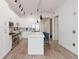 Modern white kitchen with stainless steel appliances and island at 150 E Robinson St # 1709, Orlando, FL 32801